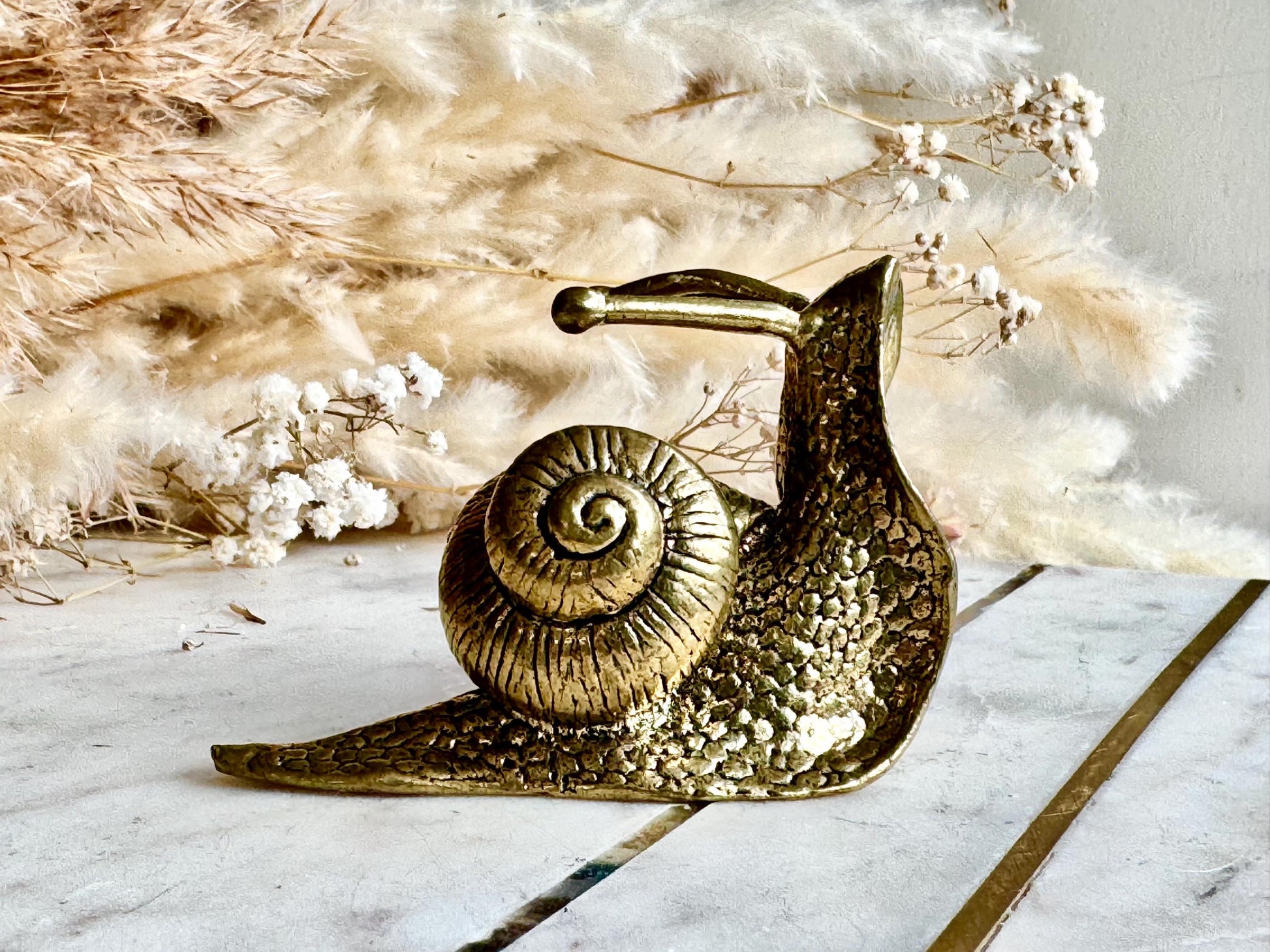 Lifelike solid brass snail figurine, detailed garden mollusk sculpture, vintage nature-inspired ornament, unique brass gastropod paperweight