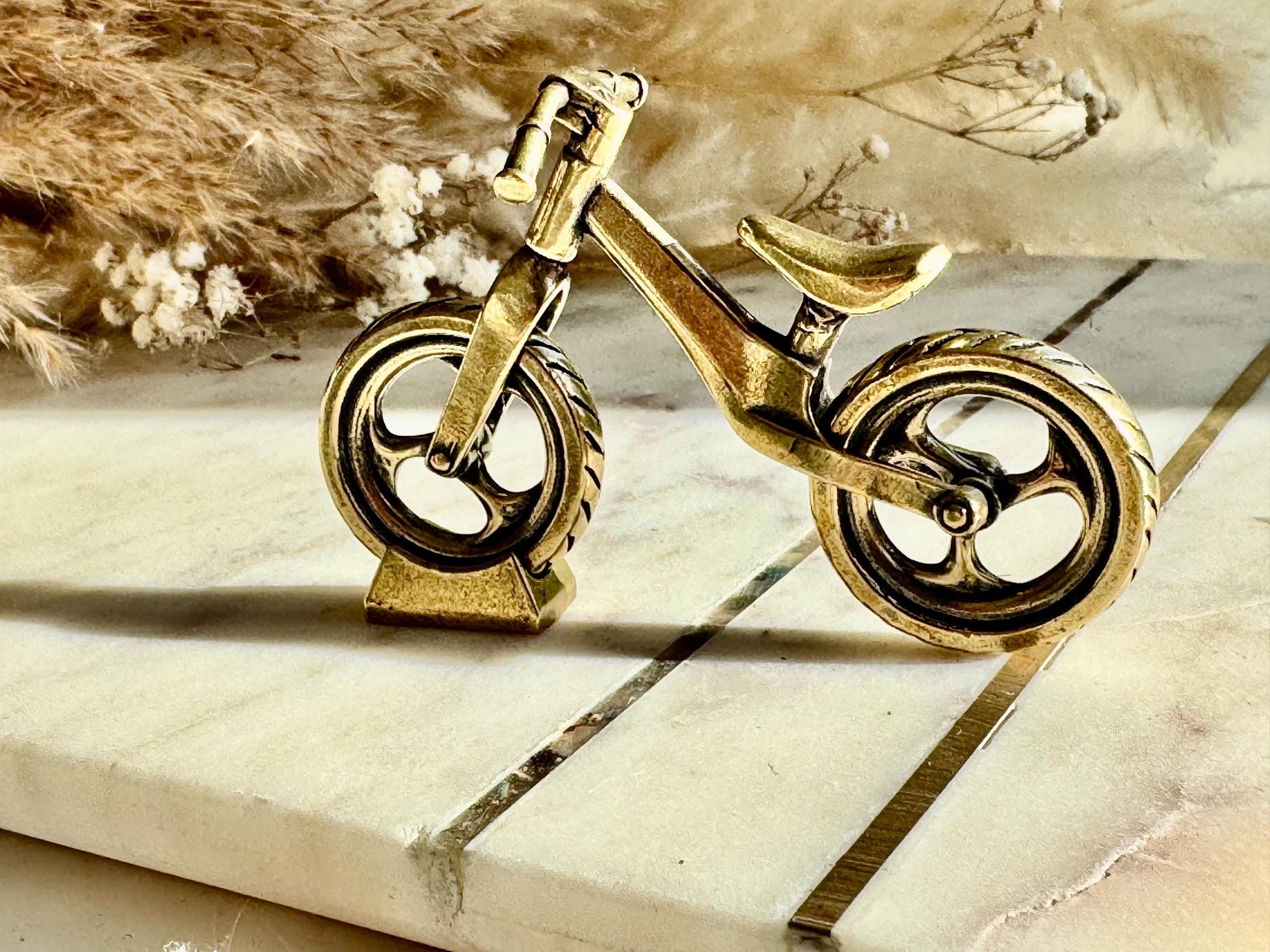 Solid brass balance bike figurine, rolling wheels model, miniature bicycle sculpture, unique metal cycling decor, collectible biker