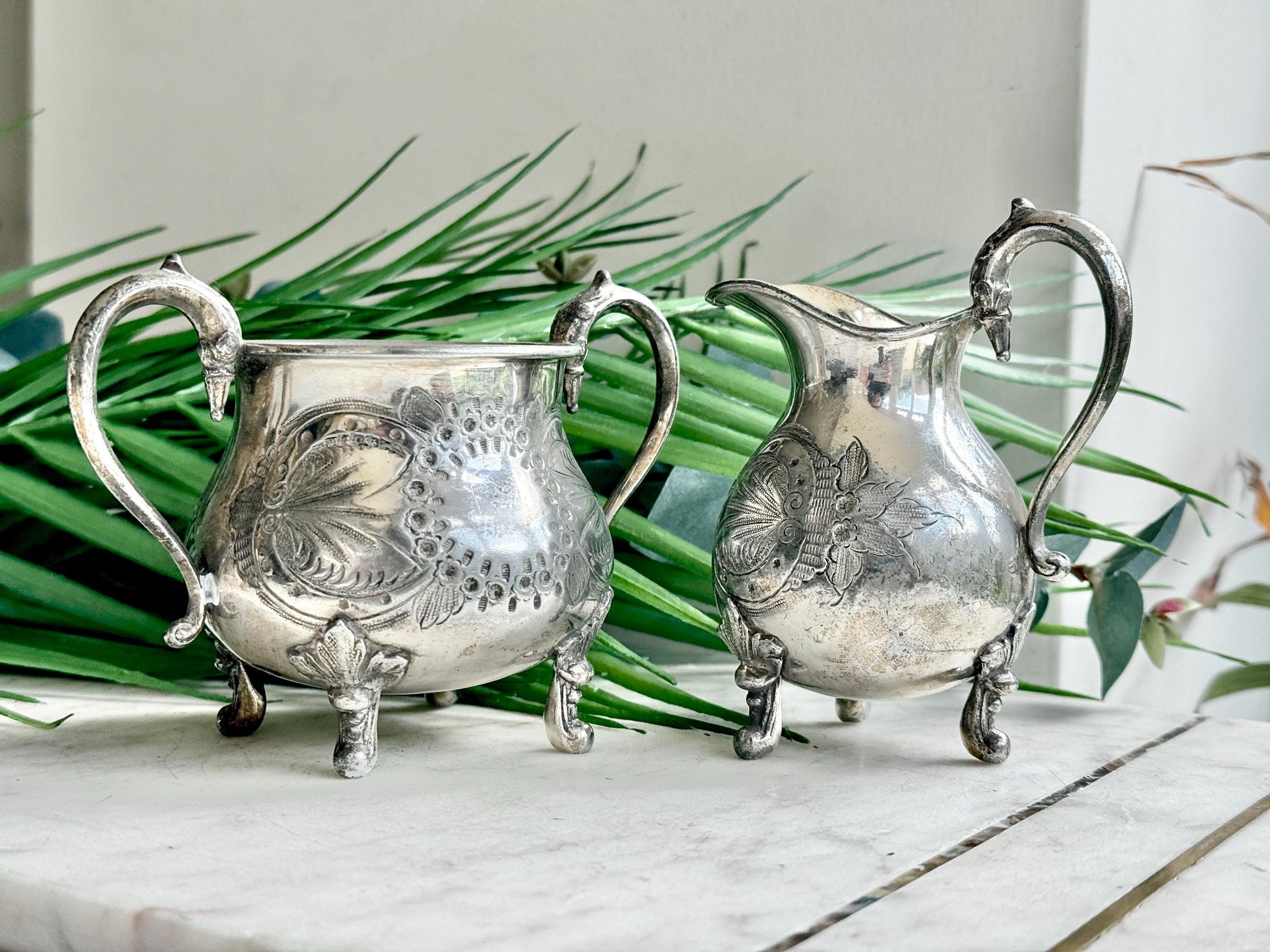 Antique Victorian Silver-Plated Milk Jug and Sugar Bowl – Ornate Repoussé Floral Design, Footed, British Silverware (c. 19th Century)