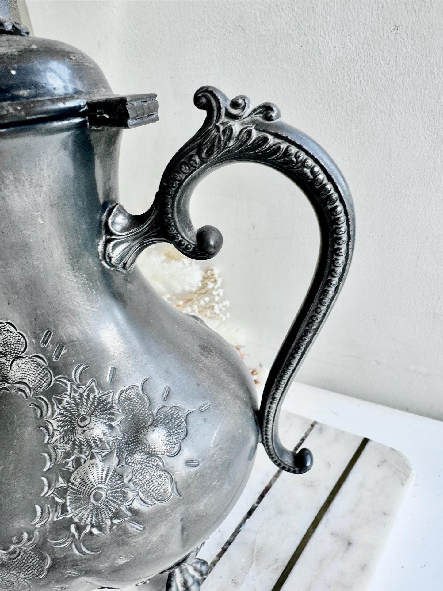 Antique Silver-Plated Rococo-Style Coffee Pot with Ornate Floral Engraving and Footed Base