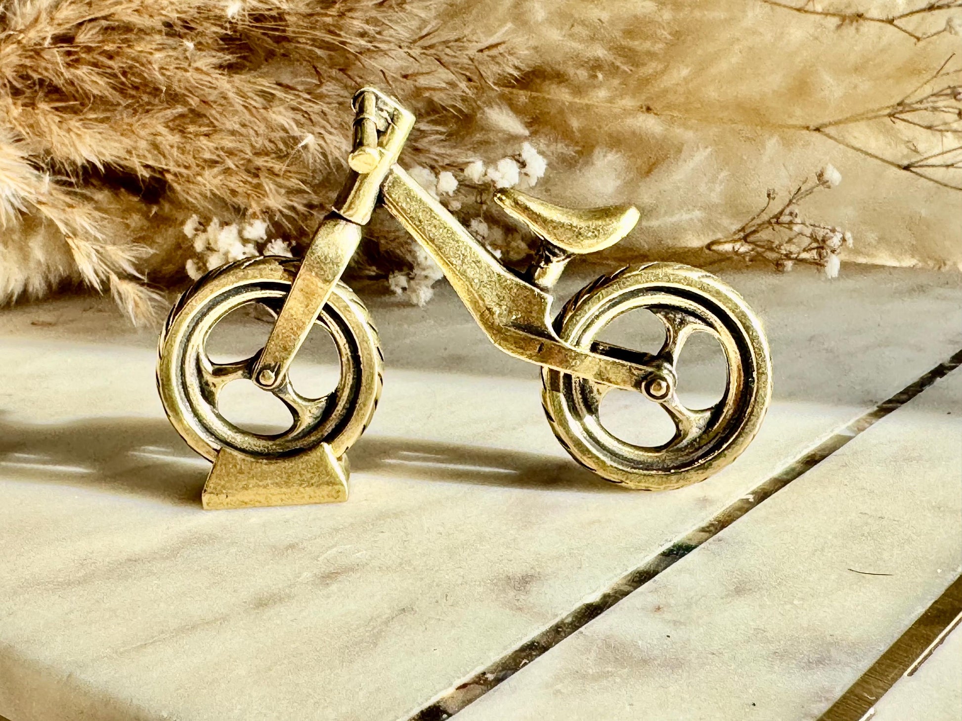 Solid brass balance bike figurine, rolling wheels model, miniature bicycle sculpture, unique metal cycling decor, collectible biker