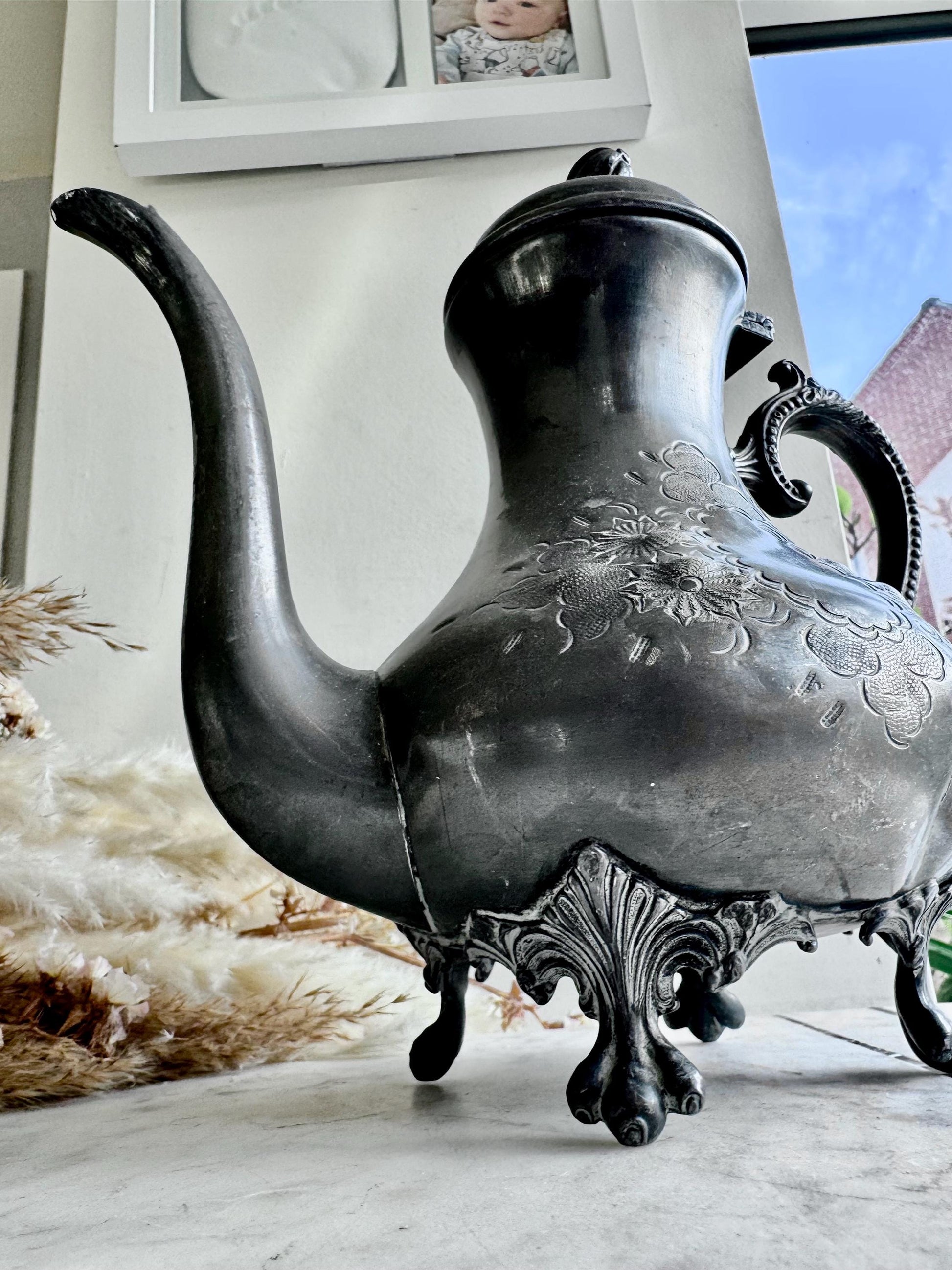 Antique Silver-Plated Rococo-Style Coffee Pot with Ornate Floral Engraving and Footed Base