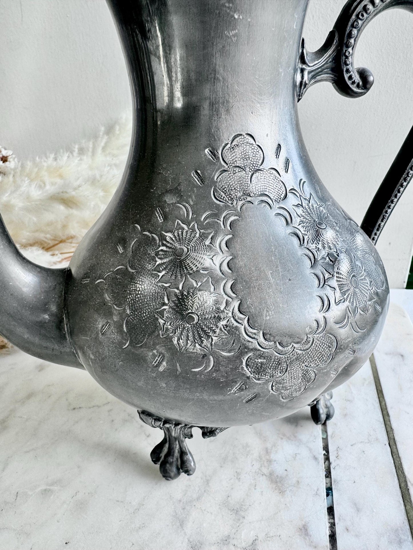 Antique Silver-Plated Rococo-Style Coffee Pot with Ornate Floral Engraving and Footed Base