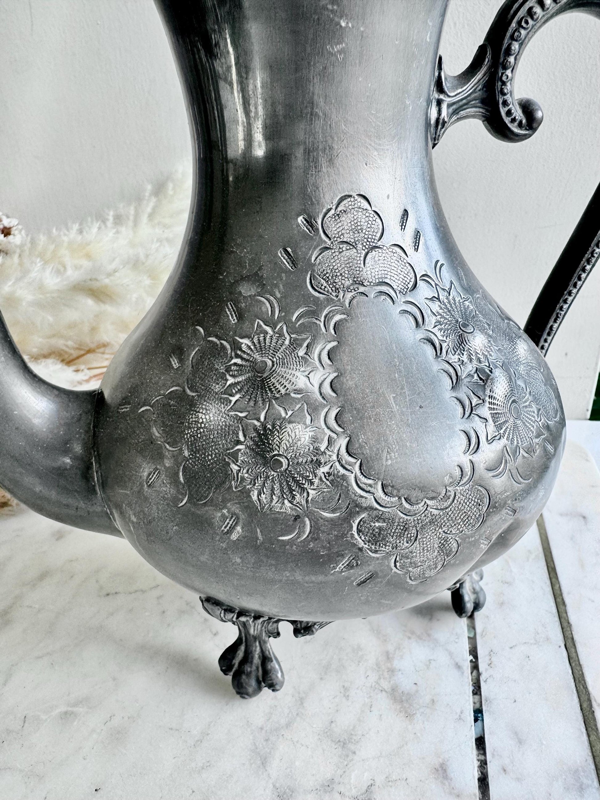 Antique Silver-Plated Rococo-Style Coffee Pot with Ornate Floral Engraving and Footed Base