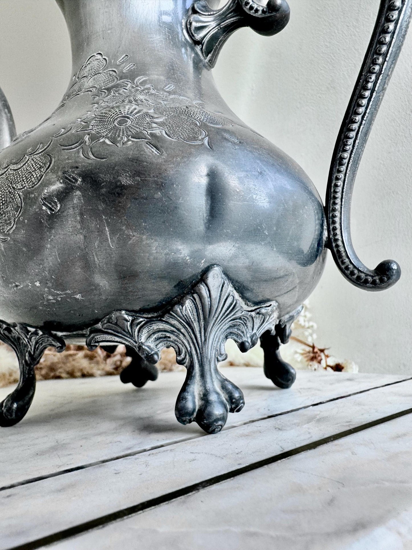 Antique Silver-Plated Rococo-Style Coffee Pot with Ornate Floral Engraving and Footed Base