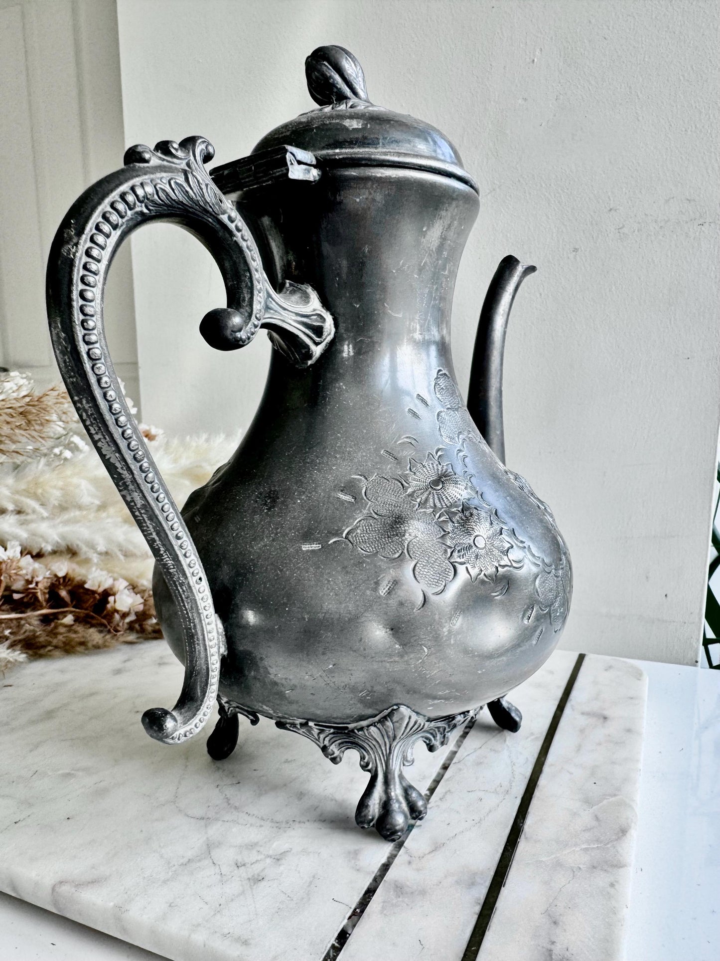 Antique Silver-Plated Rococo-Style Coffee Pot with Ornate Floral Engraving and Footed Base