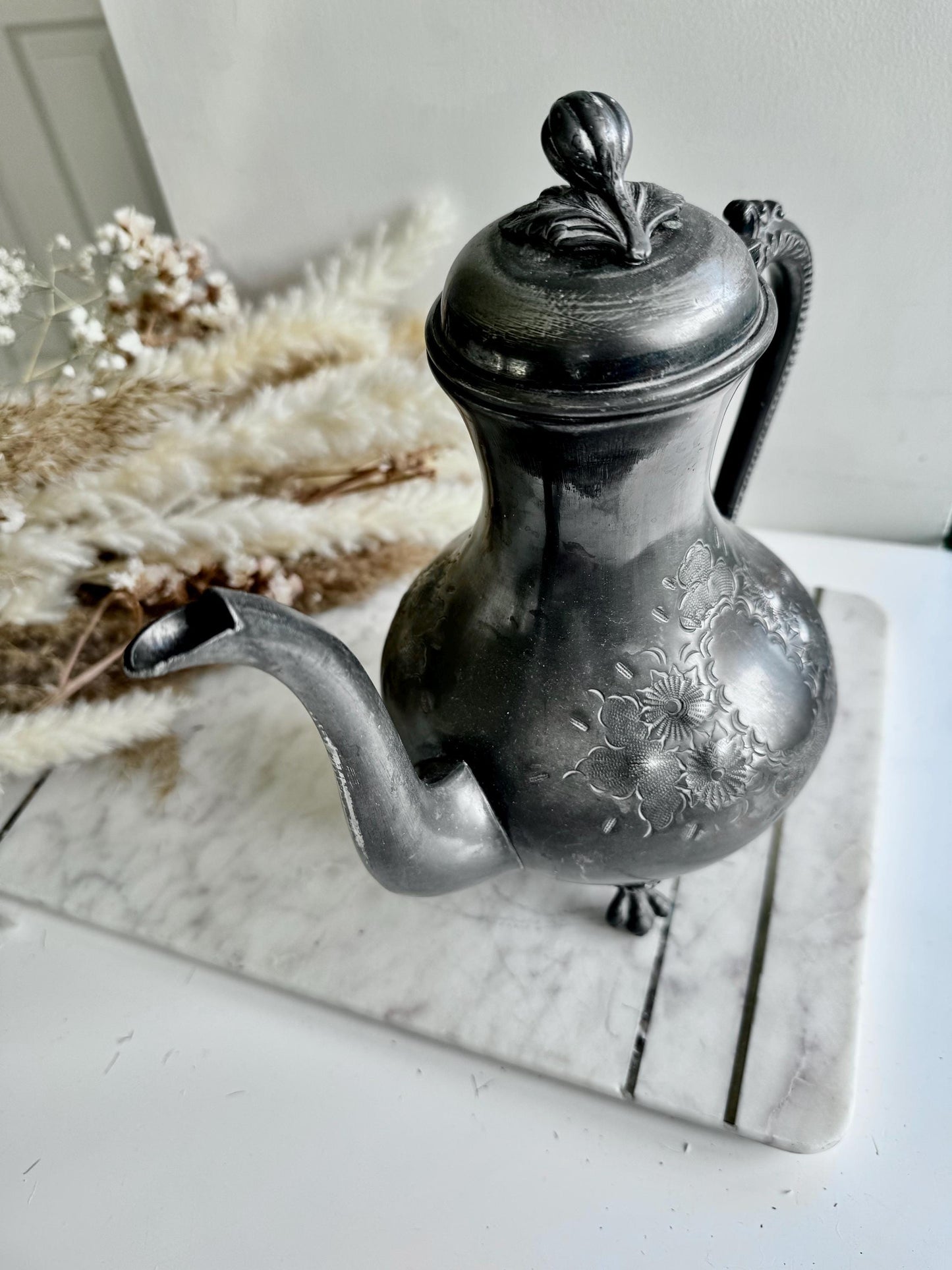 Antique Silver-Plated Rococo-Style Coffee Pot with Ornate Floral Engraving and Footed Base