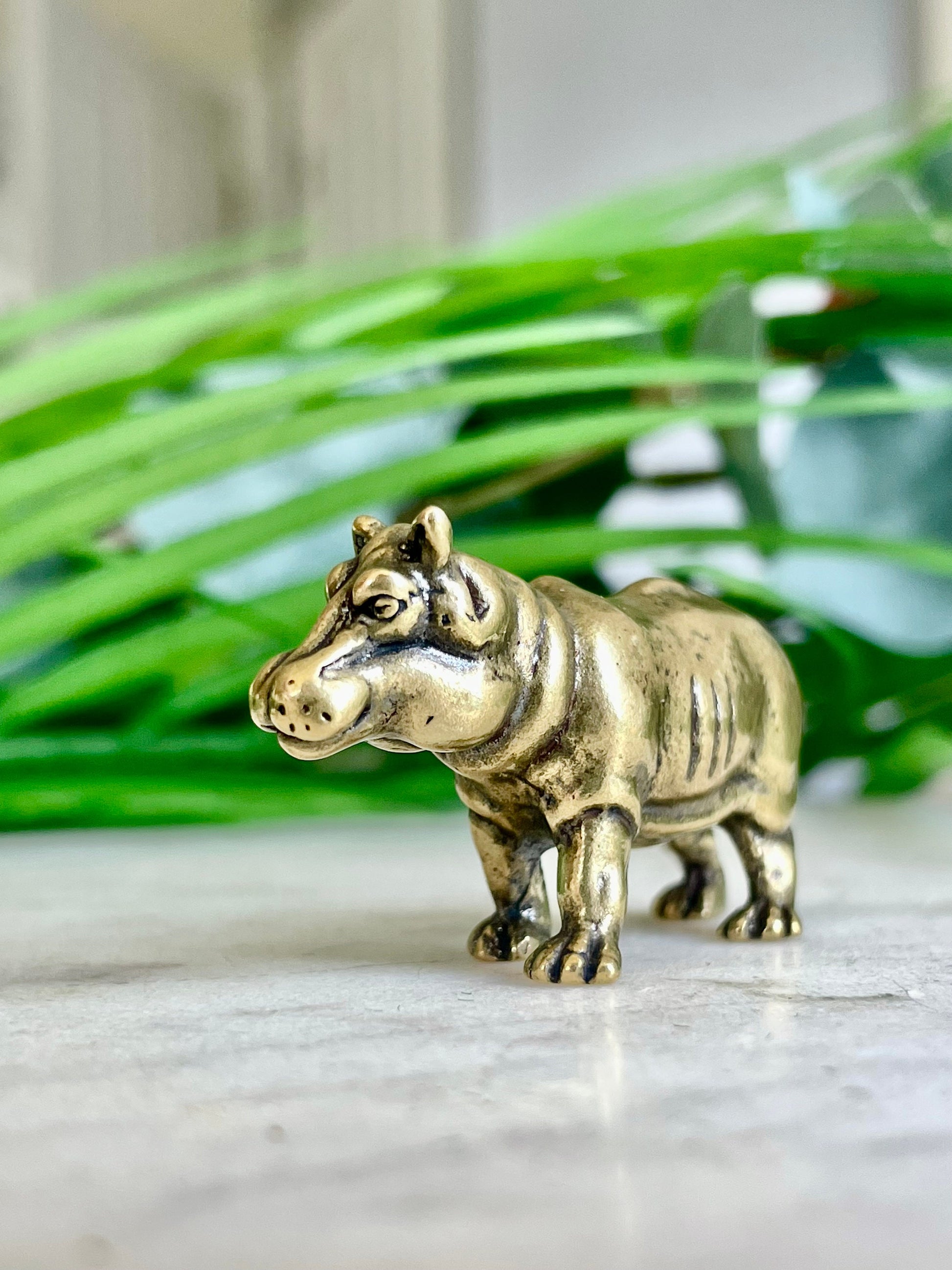 Solid brass hippo figurine, charming hippopotamus sculpture, safari wildlife, jungle-themed nursery decoration, whimsical adornment