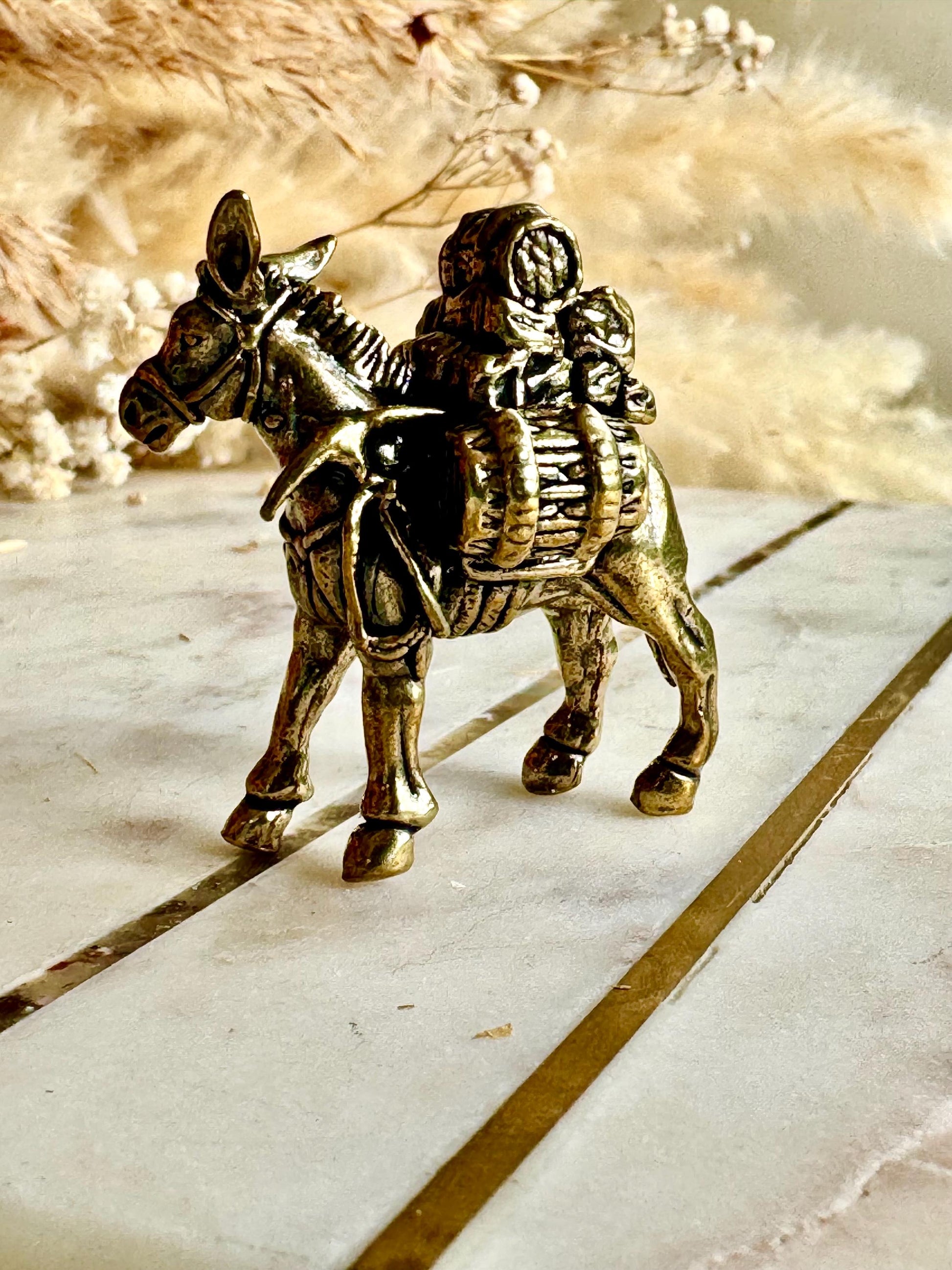 Solid brass traveler on donkey figurine, rustic caravan sculpture, nomad metal ornament, miniature desert journey souvenir