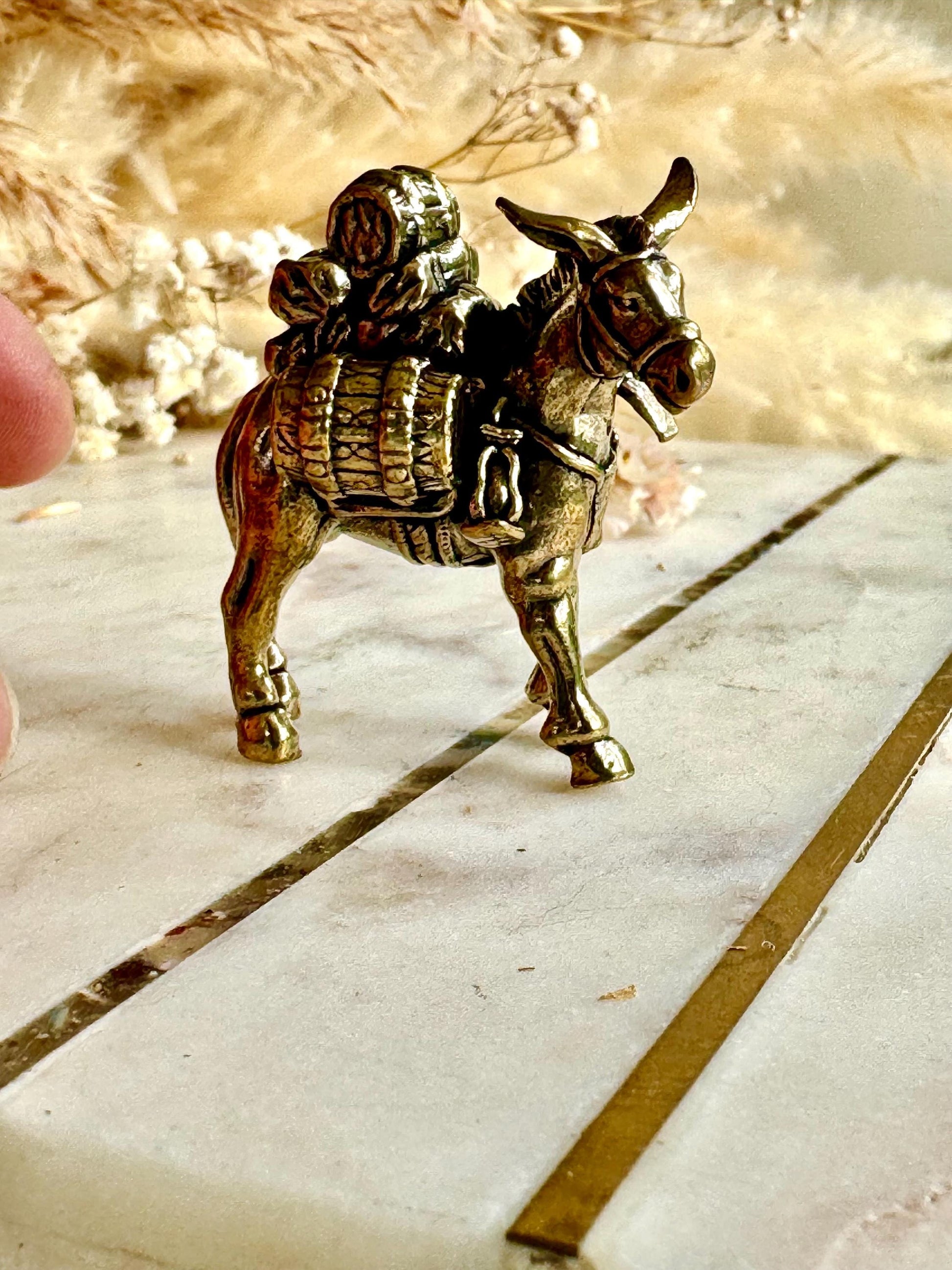 Solid brass traveler on donkey figurine, rustic caravan sculpture, nomad metal ornament, miniature desert journey souvenir