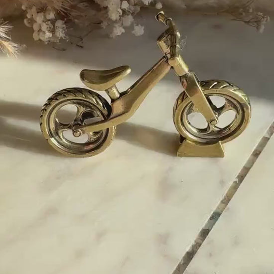 Solid brass balance bike figurine, rolling wheels model, miniature bicycle sculpture, unique metal cycling decor, collectible biker